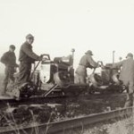 small group of internees work on the railroad