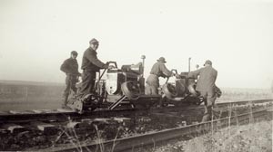 small group of internees work on the railroad