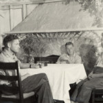 3 men at a table