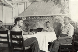 3 men at a table