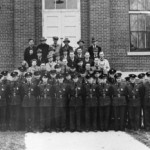 the staff of Ft. Lincoln, lined up in front of brick building