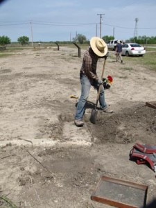 man shoveling dirt