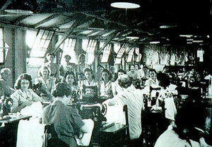 numerous women with sewing machines