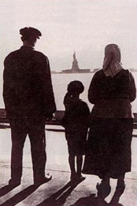 couple with small child viewing Statue of Liberty