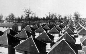 rows of square huts with tent-like roofs