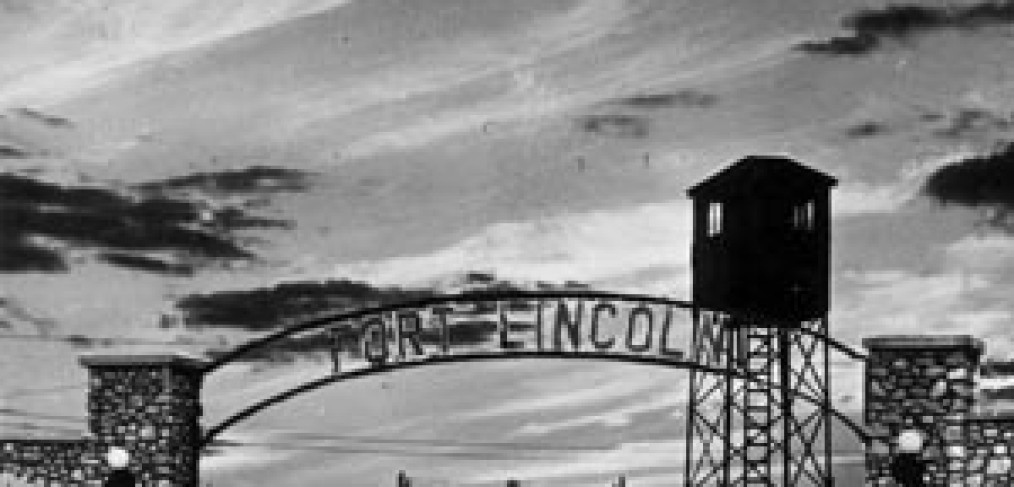 sunset view of Fort Lincoln entry gate arch and guard tower