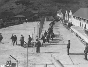 long line of men leaving camp
